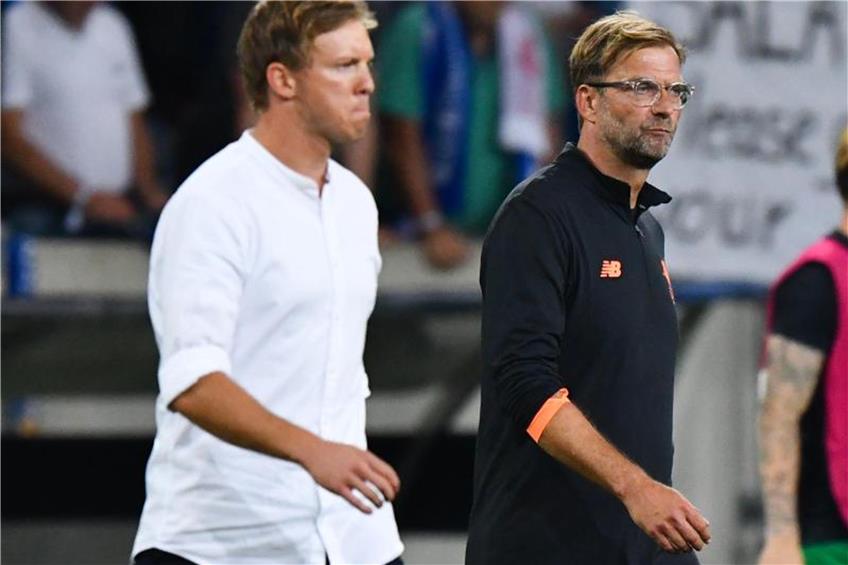 Hoffenheims Trainer Julian Nagelsmann und Liverpools Trainer Jürgen Klopp. Foto: Uwe Anspach dpa
